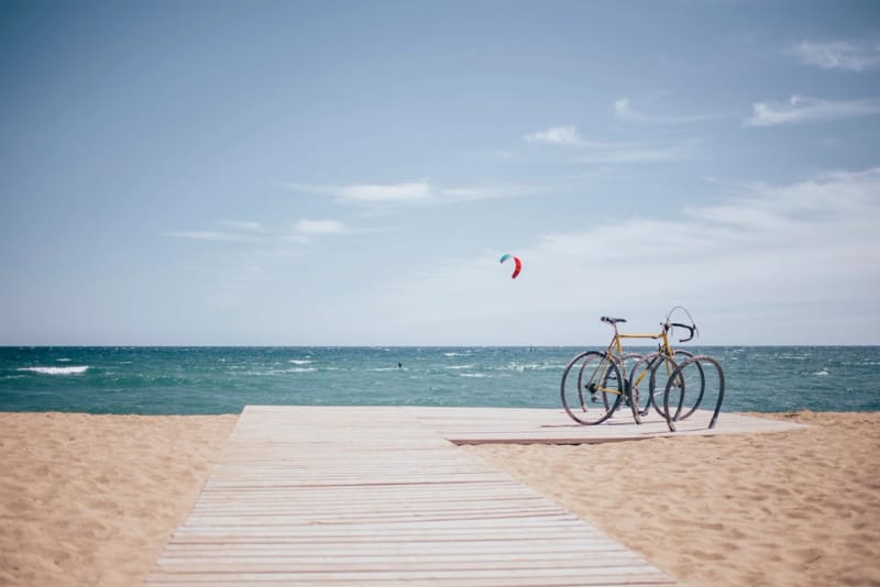 bike parked beach kite surfer